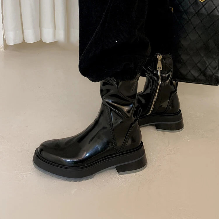Side view of HighSta ankle platform boots, a black designer leather ankle boots.