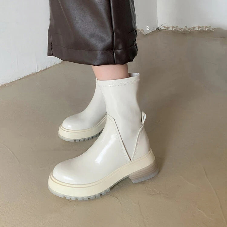 The young lady is wearing HighSta White luxury designer boots, the HS platform boot for women.